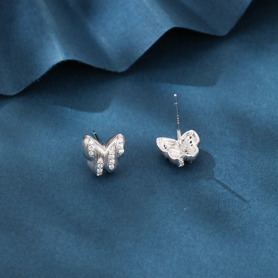 925 Sterling Silver Elegant Butterfly Stud Earrings With Silver Zircon Accents On Blue Backdrop