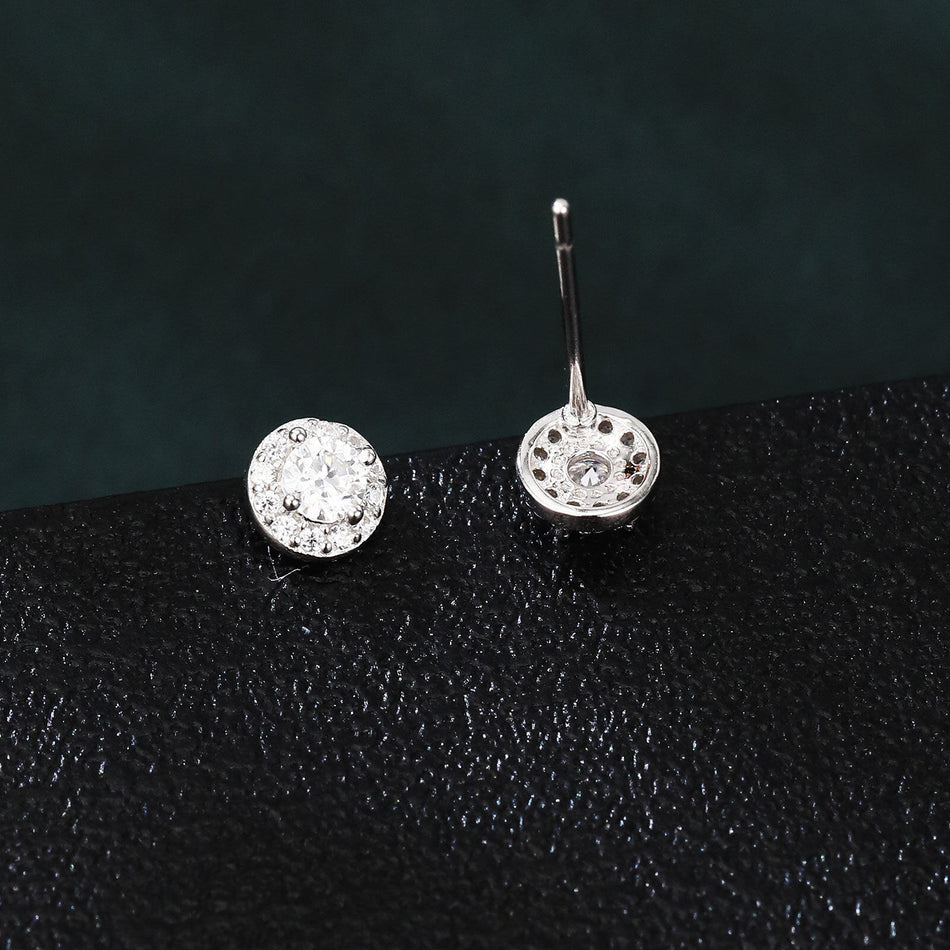 925 Sterling Silver Elegant Moissanite Halo Stud Earrings On Black Wood With Teal Background