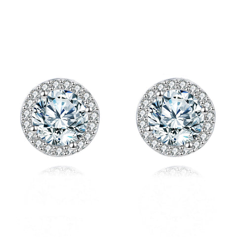 925 Sterling Silver Elegant Moissanite Halo Stud Earrings On Black Wood With Teal Background