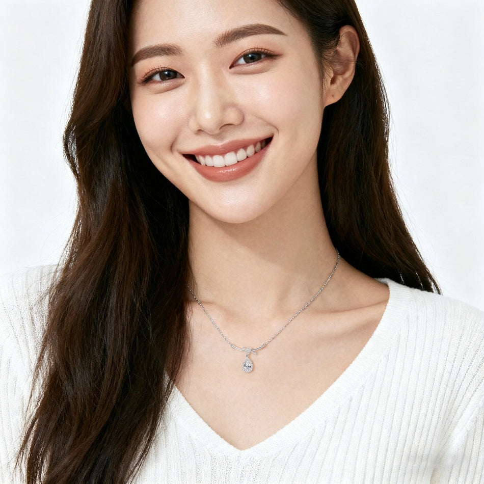 925 Sterling Silver Elegant Zircon Teardrop Necklace With Bow Accent In Sterling Silver